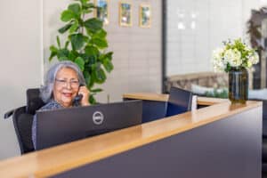 Receptionist answering phone at Rock Creek Care Center